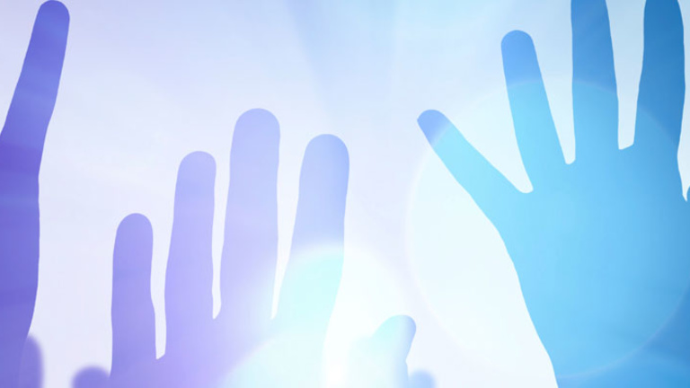 Abstract photo of hands in bright light